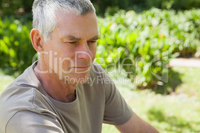 Thoughtful mature man at the park