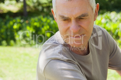 Thoughtful mature man at park