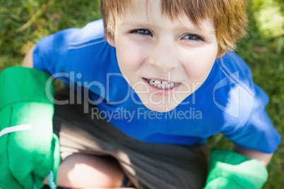 Young boy in gardening gloves at park
