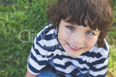 Close-up of a cute boy smiling at park