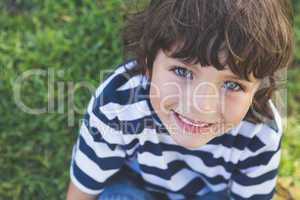 Close-up of a cute boy smiling at park