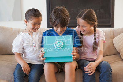 Happy young kids with gift box