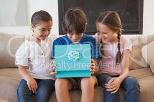 Happy young kids with gift box