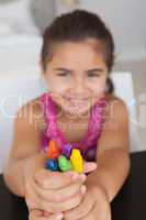 Close-up of a girl holding drawing colors