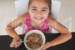 Close-up portrait of a girl having breakfast