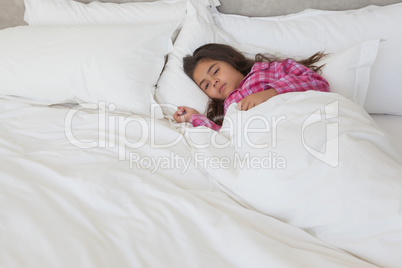 Young girl sleeping in bed at home