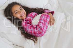Portrait of a young girl resting in bed
