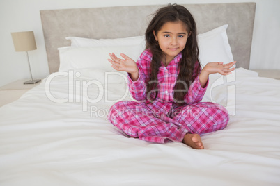 Portrait of a girl sitting in bed