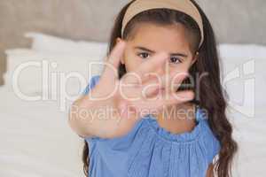 Close-up portrait of a young girl gesturing