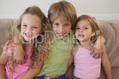 Portrait of happy young kids in living room