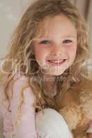 Close-up portrait of a young smiling girl