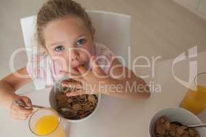 High angle portrait of a girl having breakfast