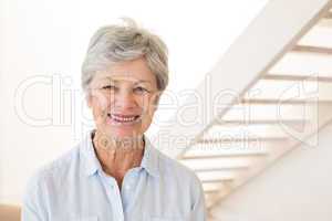 Retired woman smiling at the camera