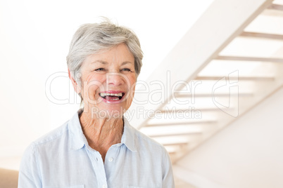 Retired woman smiling and laughing