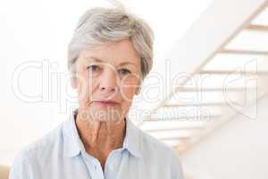 Retired woman frowning at the camera