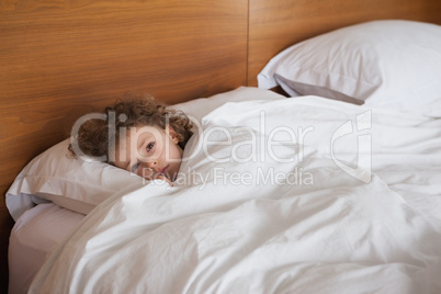 High angle portrait of a girl resting in bed