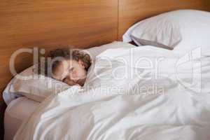 High angle portrait of a girl resting in bed