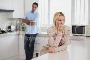 Couple not talking after an argument in kitchen