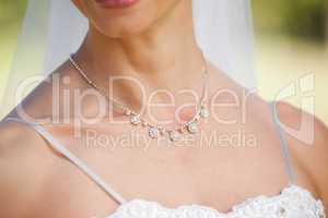 Mid section of a beautiful bride wearing a necklace