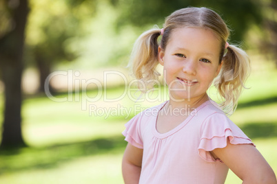 Portrait of a smiling young girl at park