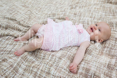 Cute baby lying on blanket