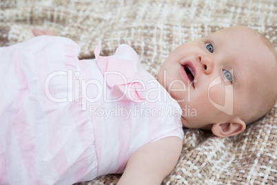 Cute baby lying on blanket