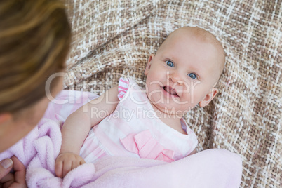 Portrait of a cute baby lying on blanket