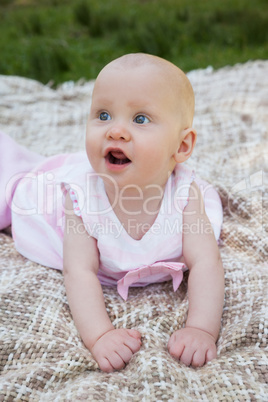 Cute baby lying on blanket