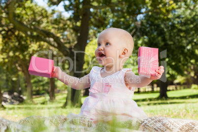 Cute baby with box at the park