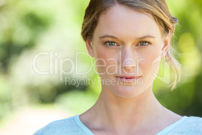 Close-up portrait of beautiful woman in park