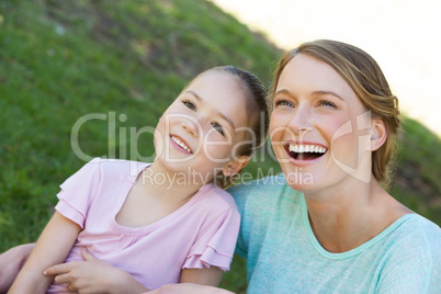 Happy mother and daughter at park