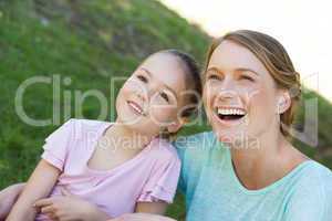 Happy mother and daughter at park