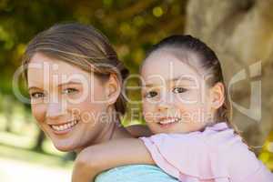 Happy mother and daughter at park