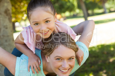Happy mother and daughter at park