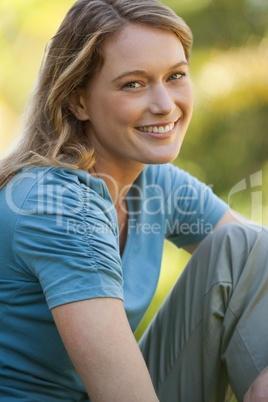 Portrait of a beautiful relaxed woman at park