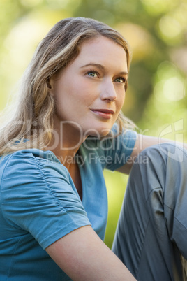 Close-up of thoughtful woman looking up in park