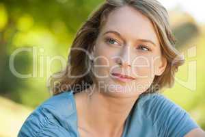 Close-up of thoughtful woman looking away in park