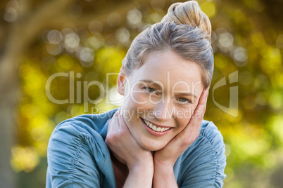 Close-up portrait of beautiful relaxed woman at park