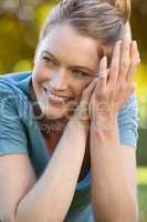 Close-up portrait of beautiful relaxed woman at park