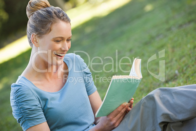 Woman reading book in park