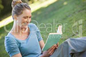 Woman reading book in park