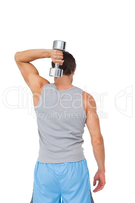 Rear view of a man exercising with dumbbell