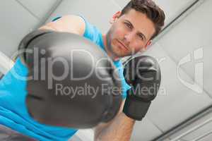Determined male boxer focused on training