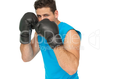 Determined male boxer focused on his training