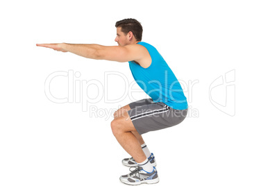 Side view of a fit young man doing stretching exercise