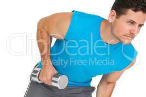 Fit young man exercising with dumbbell