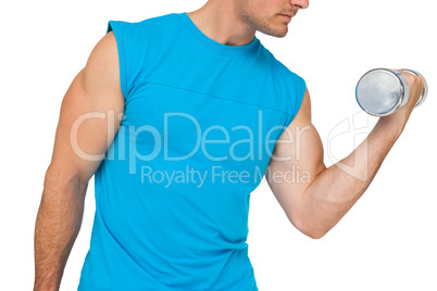 Close-up mid section of fit man exercising with dumbbell
