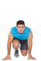 Portrait of a young sporty man in running stance