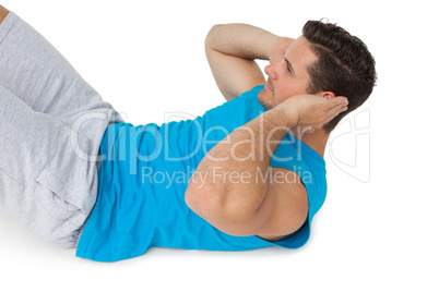 Side view of a man doing abdominal crunches