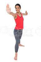 Full length of a sporty woman stretching hands